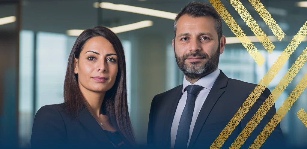 Photo of two solicitors at Axis Solicitors explaining how to apply for leave to remain as a spouse.