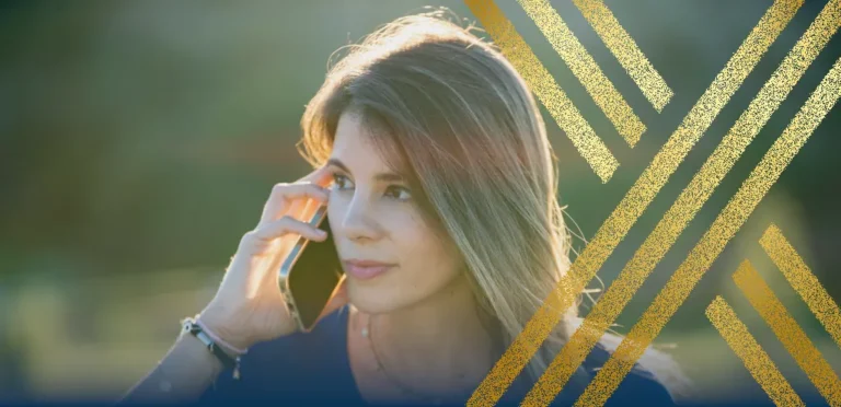 Woman with concerned expression on the phone, getting updates on changes to the Ukraine Family Scheme and Ukraine Sponsorship Scheme (Homes for Ukraine).