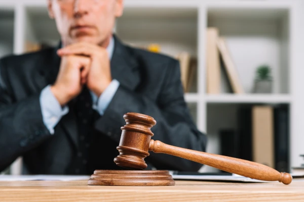 Solicitor reviewing a Administrative Removal & Deportation case at his desk.