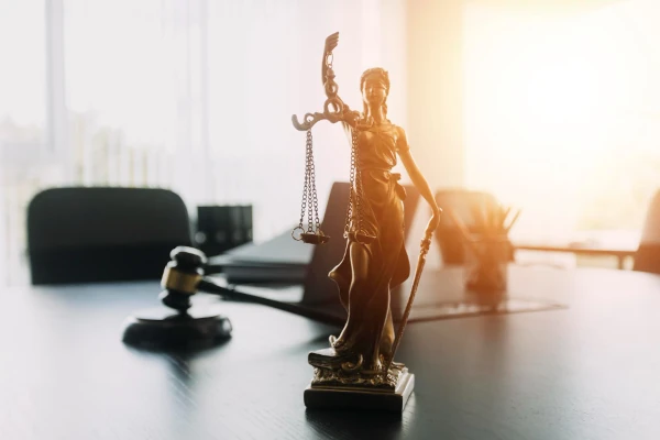 Lady Justice statue representing justice for modern slavery and human trafficking cases victims, at Axis Solicitors in Manchester.