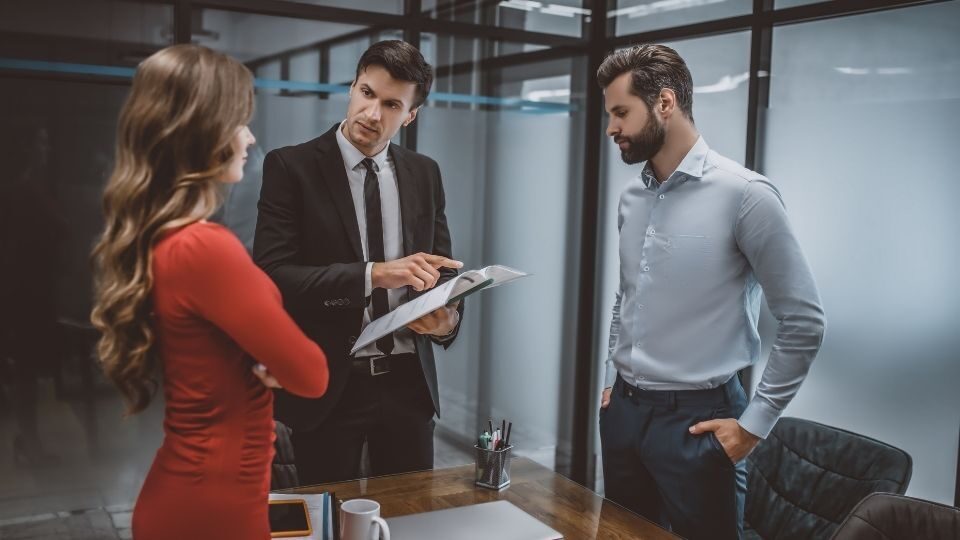 (In the image solicitor can be seen with clients discussing adverse possession claims) Adverse Possession Claim Legal Definition and Requirements