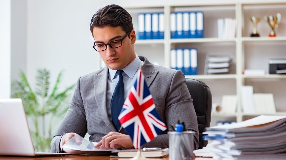 (In the image an immigration solicitor can be seen going through the conditions and obligations for visa holders)