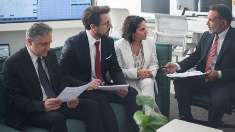 (In the image a discussion between solicitors regarding Group litigation orders can be seen)