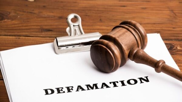 (In the image a manual can be seen on how to handle defamation cases) 