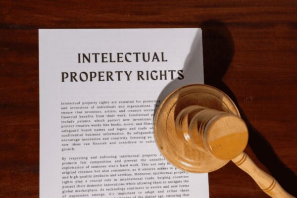 Document about Intellectual Property Rights next to a judge's gavel, relating to copyright claims and legal criteria