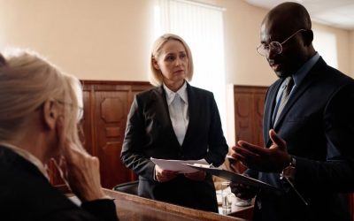 (In the image it can be seen solicitors discussing defamation case)