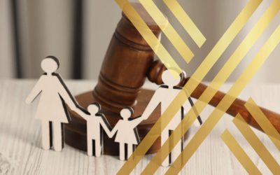 Family cutouts in front of a court gavel, representing parental rights and family law disputes.