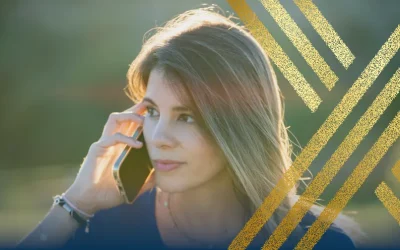 Woman with concerned expression on the phone, getting updates on changes to the Ukraine Family Scheme and Ukraine Sponsorship Scheme (Homes for Ukraine).